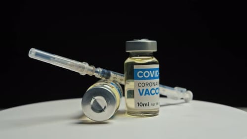 COVID-19 Vaccine Vials and Syringe Rotating