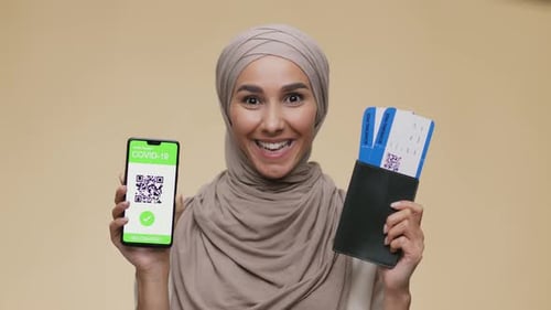 Smiling Woman Ready for Travel with Passport and Ticket