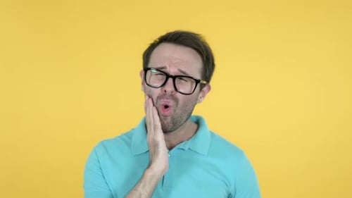 Toothache Man with Tooth Pain on Yellow Background