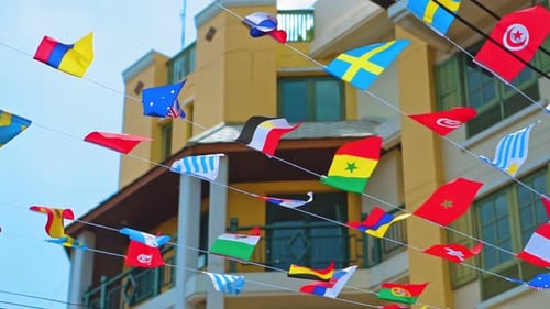 International Flags Waving in Sunny Urban Setting