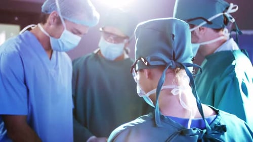 Surgical Team Performs Operation in Brightly Lit Room