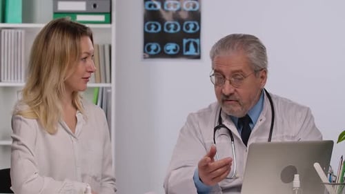Doctor Consults with Patient in Bright Office