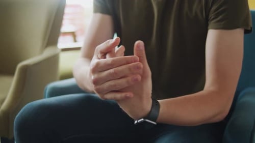 Businessman in Cafe Using Hand Sanitizer During COVID19 Pandemic