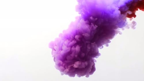 Blue and Red Ink Mixing Together Over a Pure White Background. Fantastic Texture To Place in Your
