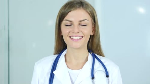 Portrait of Smiling Positive Female Doctor in Clinic