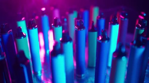 Colorful Vape Pens Under Neon Lights
