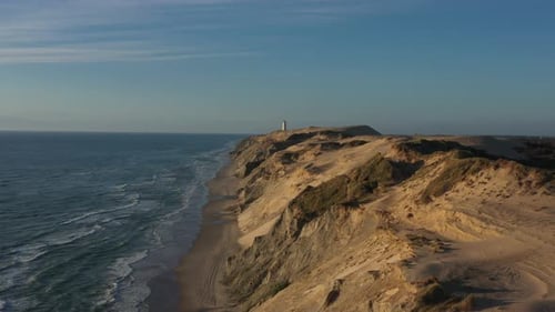 Drone Flight Over Coastline To Rubjerg Knude Lighthouse Hjorring Denmark