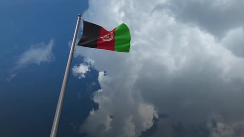 Afghanistan National Flag Waving in Wind Against Cloudy Sky