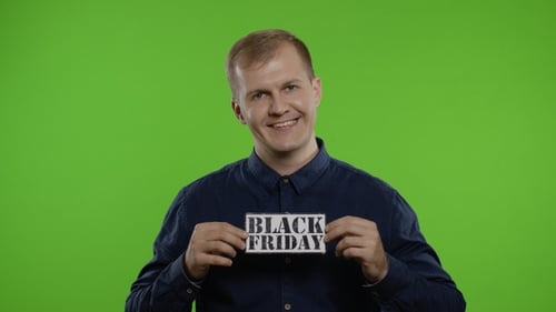 Man Holding Black Friday Sign on Green Screen