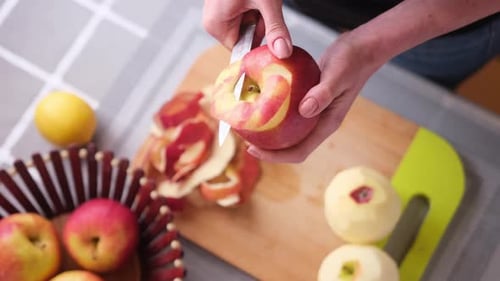 Apple Pie Preparation Series Woman is Peeling an Apple By Knife