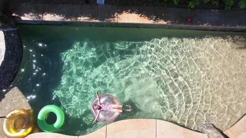 Girl Relaxing In Pool