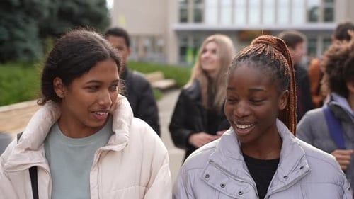 Diverse Students Walking and Talking on College Campus
