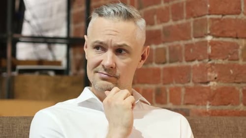 Portrait of Thinking Pensive Middle Age Man