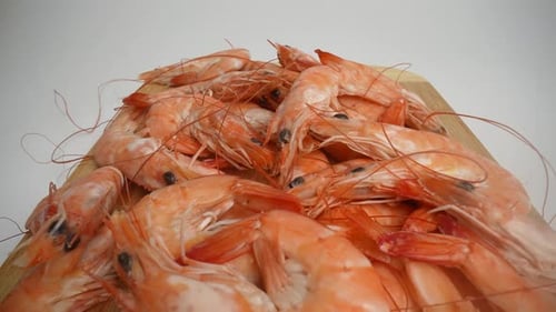 Pile of Fresh Cooked Shrimp on Cutting Board