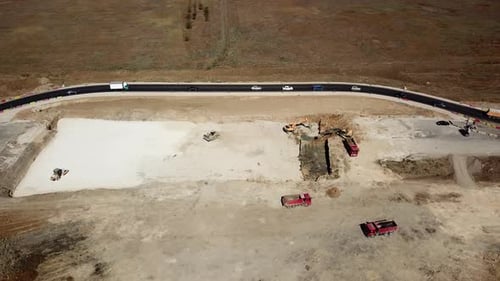 Aerial Road Constructions, Machinery and Mine Equipment Near Road on Sandy Surface