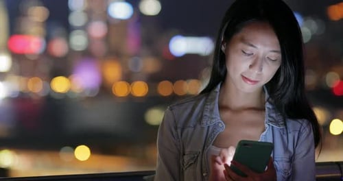 Woman Use of Mobile Phone at Night