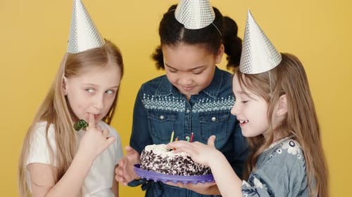 Kids with Birthday Cake Celebrating Birthday Copy Space Orange Background