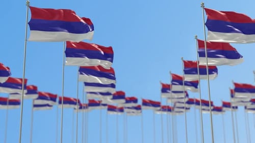 Waving Republika Srpska Flags Against Clear Blue Sky