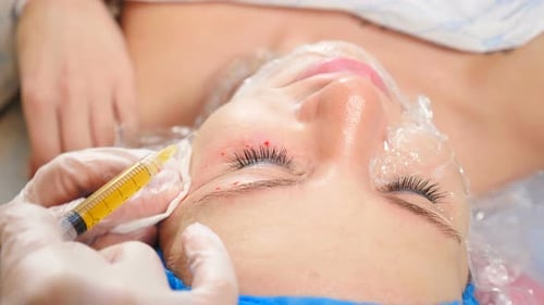 Woman Receiving Cosmetic Injections for Skin Treatment