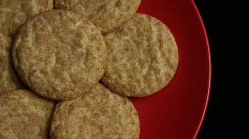 Delicious Snickerdoodle Cookies Stacked on a Red Plate
