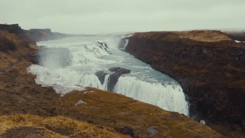 Beautiful Waterfall Flowing in a Rugged Landscape