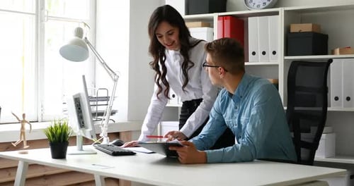 Colleagues Discussing Project in Bright Office