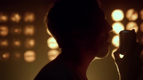 Unrecognizable Man Singing Microphone in Night Club