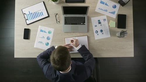 Responsible Businessman Writing in Notebook, Making To-Do List, Time Management