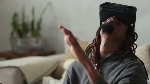 Man Experiencing Virtual Reality Headset Indoors