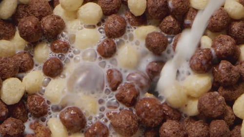 Milk Being Poured Into Cereal Balls