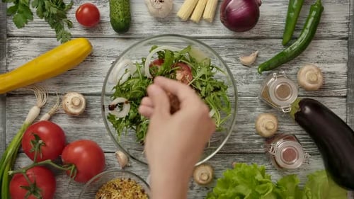 Adding Red Pepper Flakes to Garden Salad