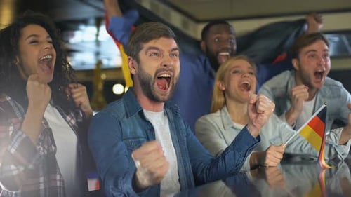 Group of friends cheer and watch sports together