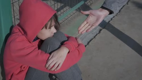 Hand Reaching Out to Help Child Stand Up
