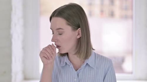 Portrait of Young Woman Feeling Sick and Coughing