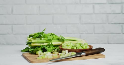 Fresh Green Celery on Cutting Board