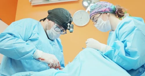 Doctors Perform Surgery in Hospital Operating Room