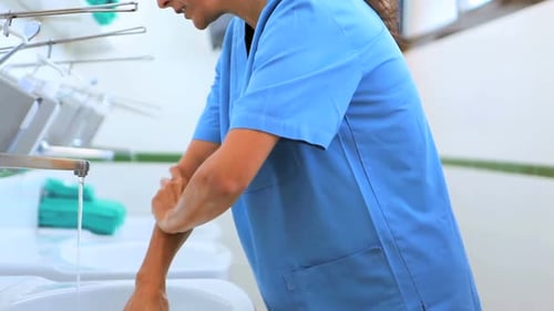 Surgeons in a hospital washing hands