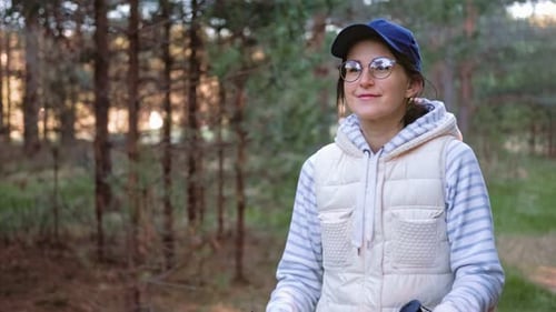 Active Hiker Woman During Nordic Walking at Forest with Trekking Poles
