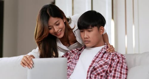 Couple at Home with Laptop