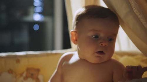 Beautiful Close Up Footage of a Cute Newborn Baby Lying on the Back in Child