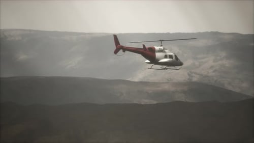 Extreme Slow Motion Flying Helicopter Near Mountains with Fog