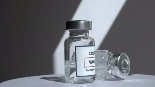 Coronavirus Covid Vaccines Rotate on a White Background in a Medical Laboratory