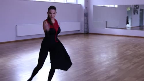 Woman Dances in Dance Studio