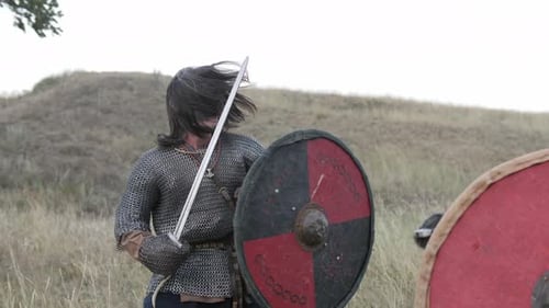 Men in Chainmail Fight with Swords and Shields