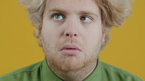 Man Makes Funny Faces in Close Up Shot