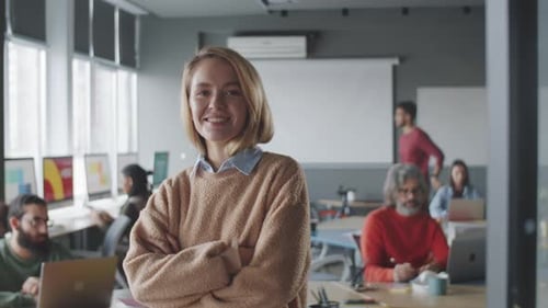 Beautiful Businesswoman Smiling and Posing for Camera in Office