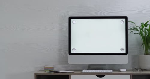 Video of computer on wooden table with copy space in office