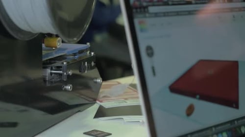 Working 3D Printer and Laptop with Model on Screen