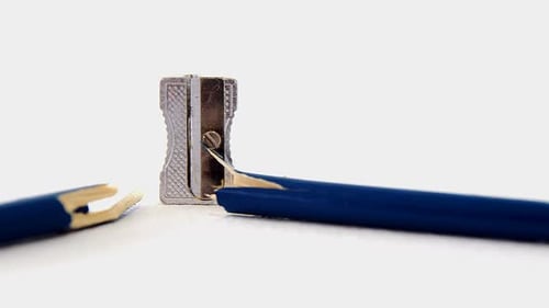 Broken blue pencil with sharpener