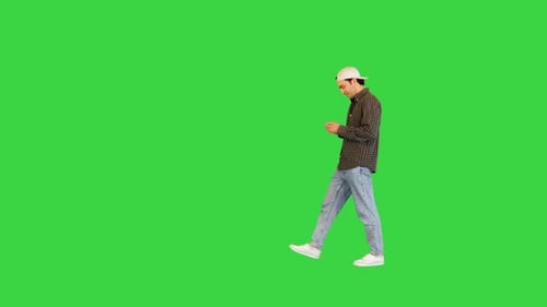 Young White Man Walks Stops to Take a Selfie on a Green Screen Chroma Key